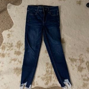 Distressed hem skinny jeans